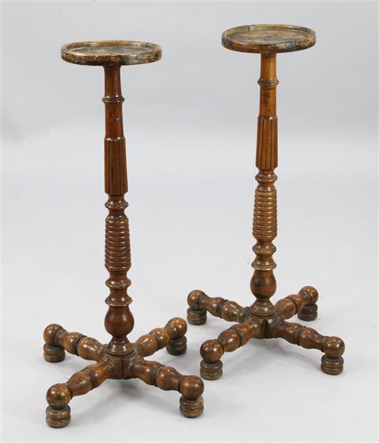 A pair of mid 19th century turned fruitwood torcheres, H.2ft 8in.